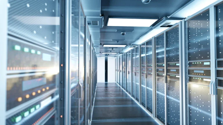 Server room with glass panels and blinking lights
