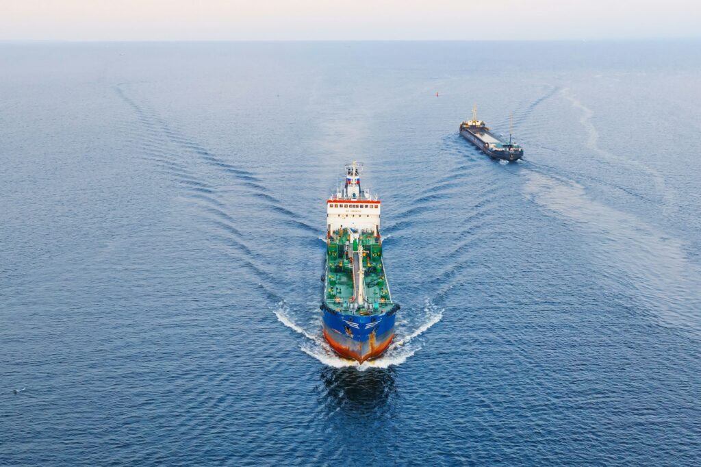 Two cargo ships sailing on the ocean