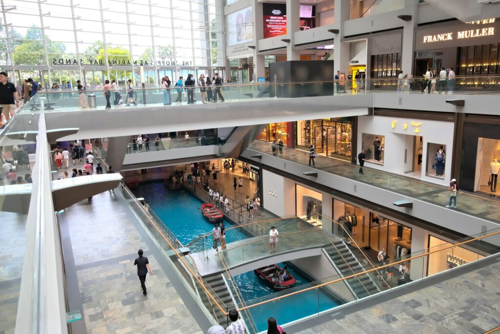 Shoppers in a modern mall with canal